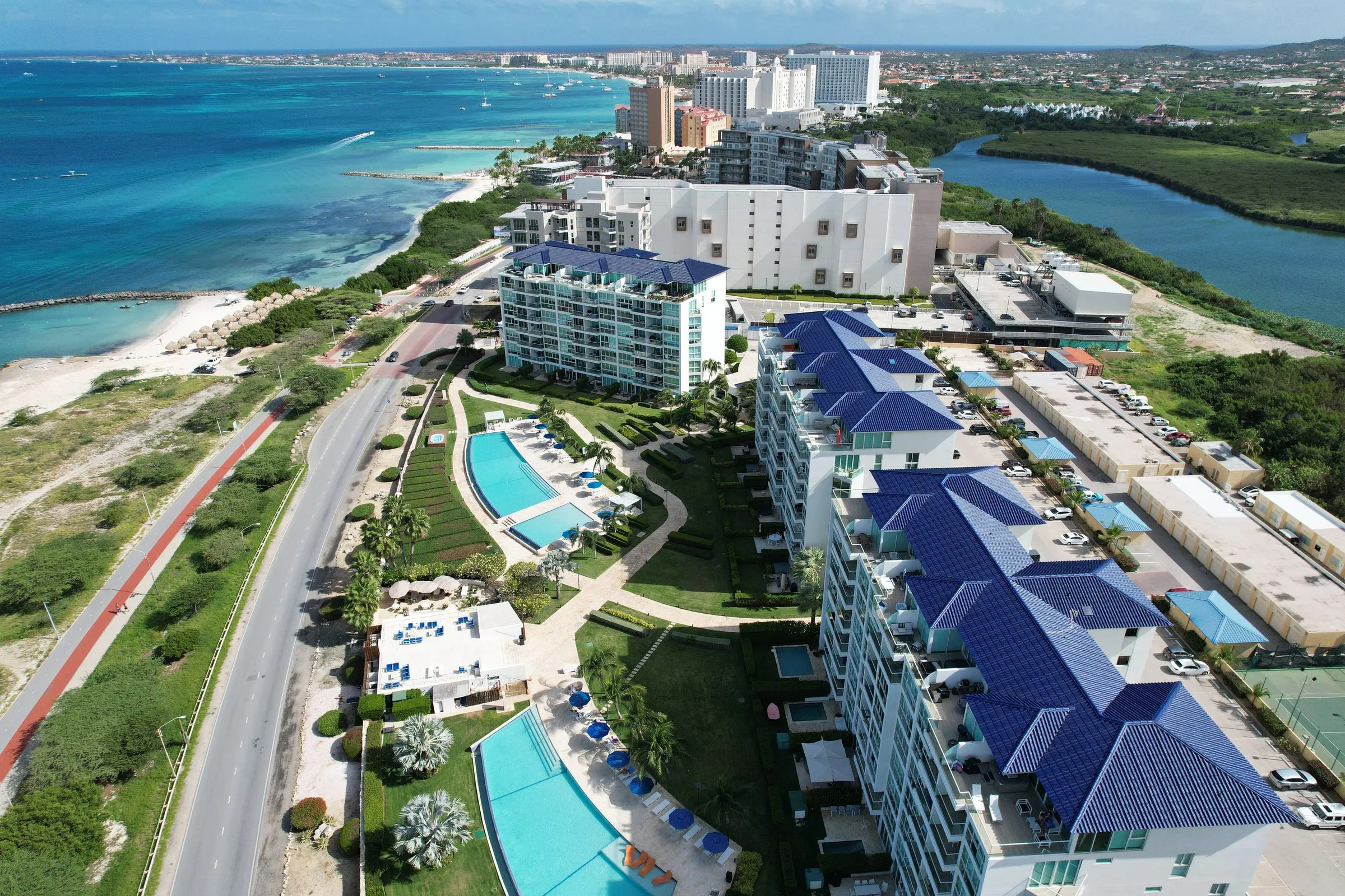 Condominium buildings with blue roofs on the Aruba coast