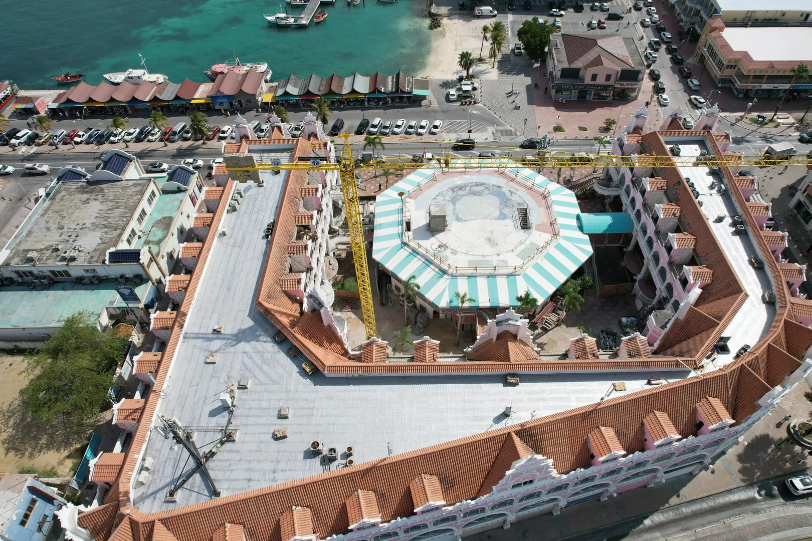 Hotel with tiled and flat roofs seen from above