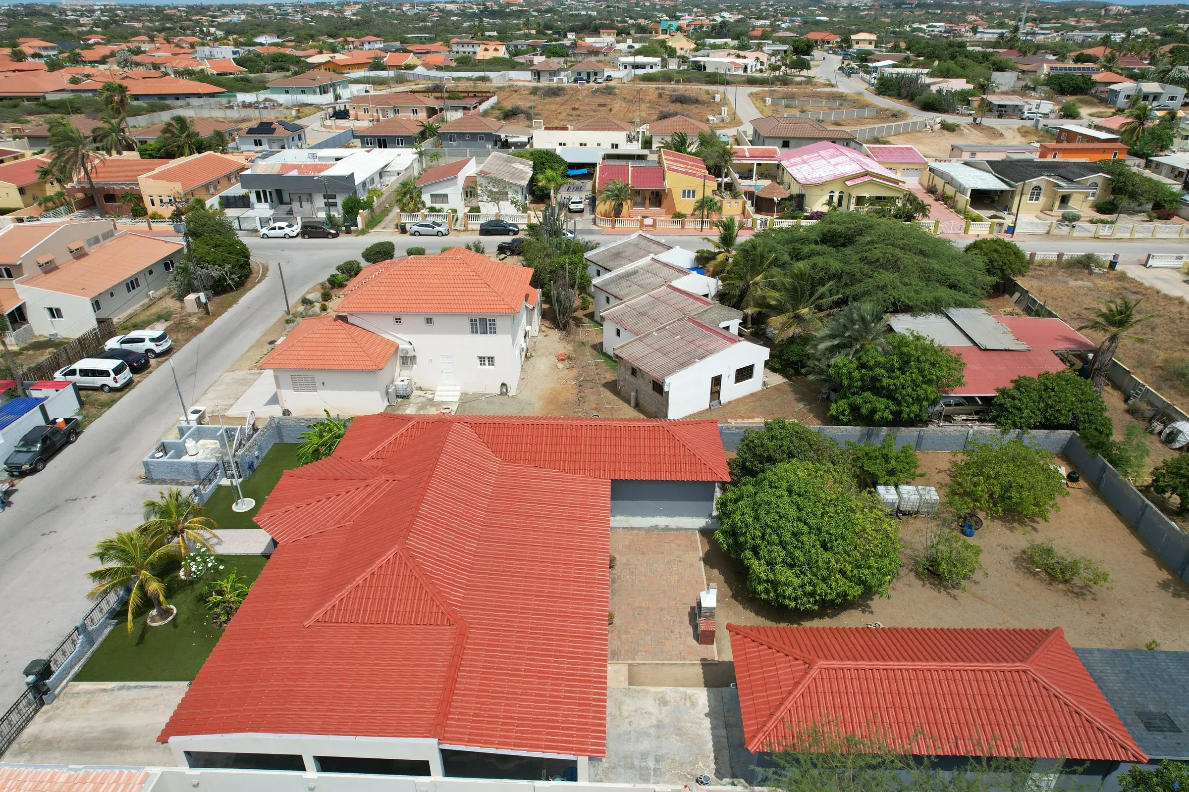Houses with red tile roofs in a neighbourhood